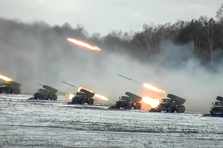 Handout video grab released by the Russian defence ministry on February 4, 2022 shows multiple rocket launchers firing on a snow-covered field during joint exercises of the armed forces of Russia and Belarus as part of an inspection of the Union State's response force, at a firing range in Belarus. (Photo by Handout/Russian defence ministry/AFP) / RESTRICTED TO EDITORIAL USE - MANDATORY CREDIT "AFP PHOTO/ RUSSIAN DEFENCE MINISTRY" - NO MARKETING - NO ADVERTISING CAMPAIGNS - DISTRIBUTED AS A SERVICE TO CLIENTS