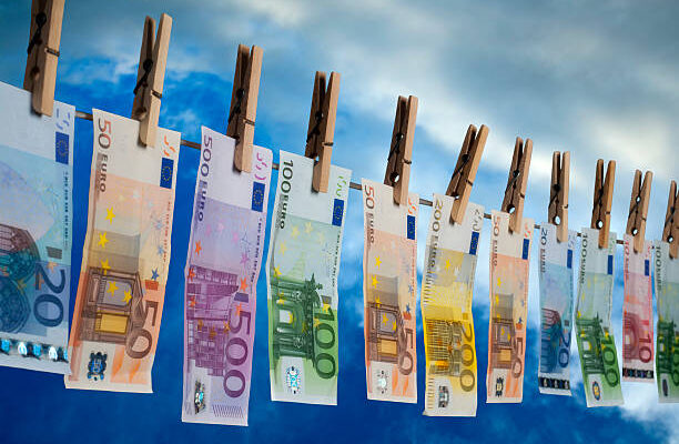 Money Laundering Euro notes with different value hanging on a line for drying money laundering euro stock pictures, royalty-free photos & images